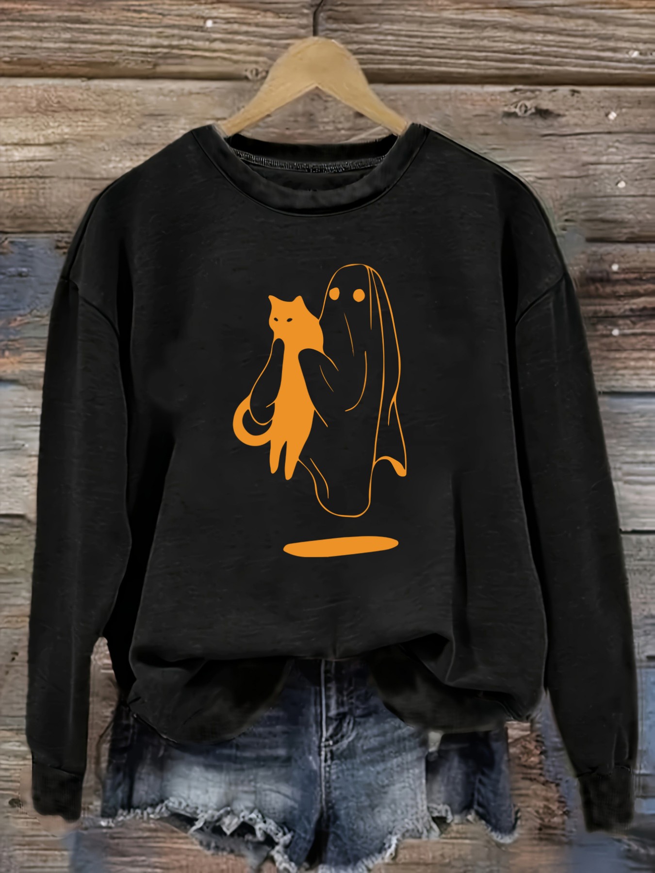 Winter Clothing Usa - เสื้อยืดแขนยาวคอกลมลำลองสำหรับผู้หญิง ลายพิมพ์แมวถือผีสีส้ม เสื้อผ้าผู้หญิงคอกลม ซักเครื่องได้ ยืดหยุ่นเล็กน้อย ทรงหลวม